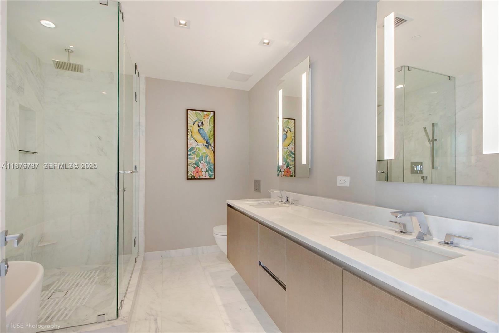 1451 Brickell Avenue, Unit 3102 Miami, FL 33131 - Photo 9 of 12 a bathroom with a granite countertop sink mirror and double