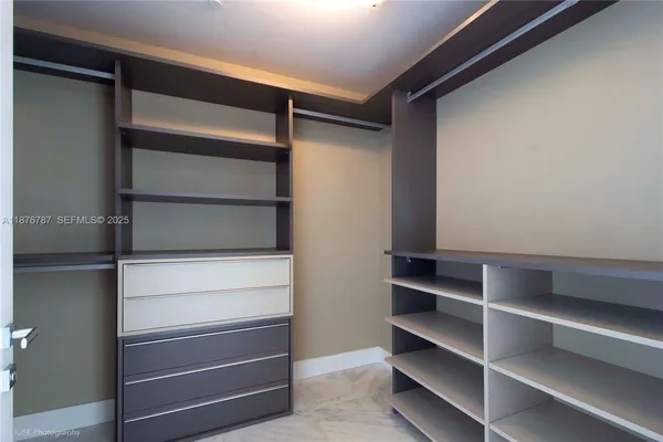 a view of an empty room with glass door