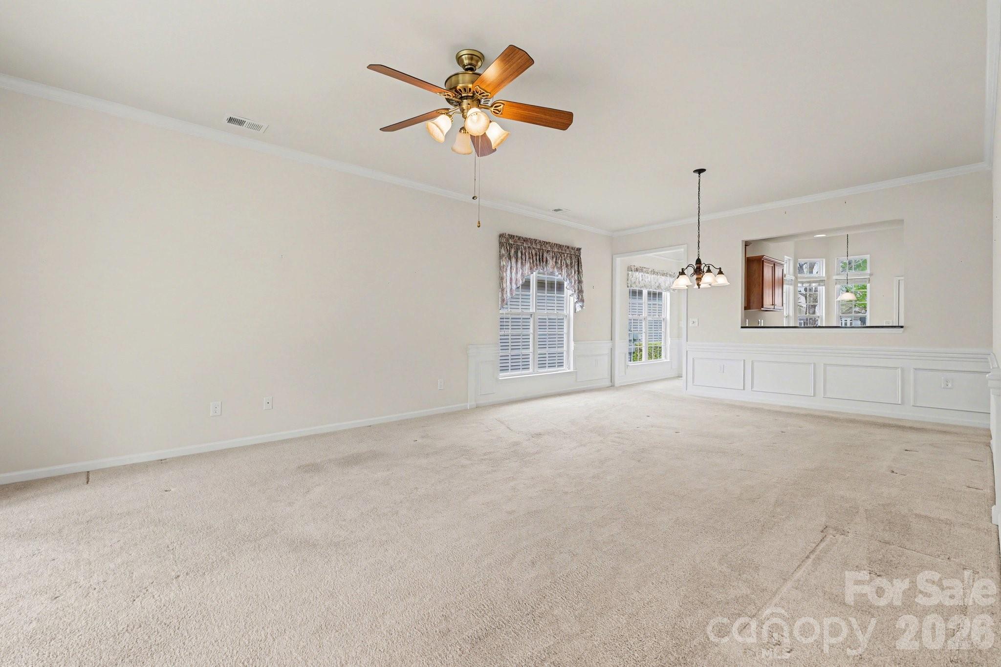 3918 Yosemite Way Fort Mill, SC 29707 - Photo 8 of 24 en empty room with ceiling fan and window