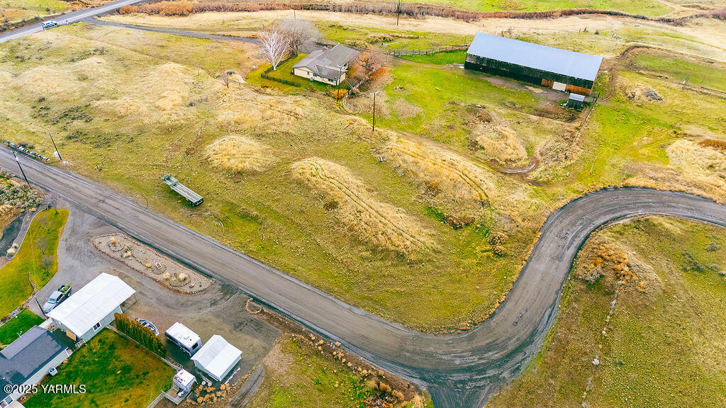 a swimming pool with outdoor seating and yard