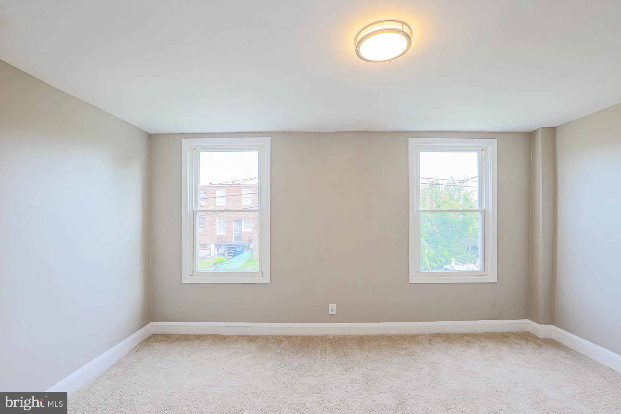 130 Reedbird Avenue Baltimore, MD 21225 - Photo 30 of 43 Second bedroom (back of house)