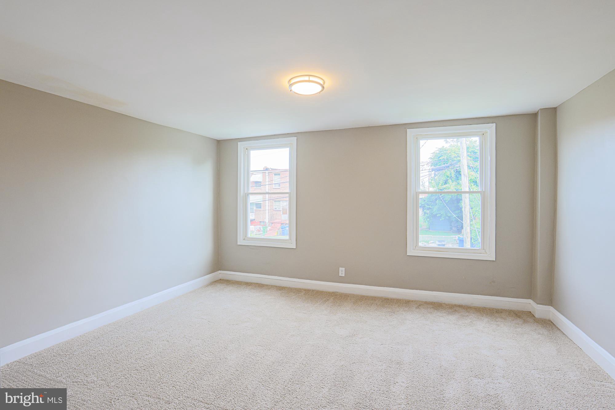 130 Reedbird Avenue Baltimore, MD 21225 - Photo 31 of 43 Second bedroom (back of house)