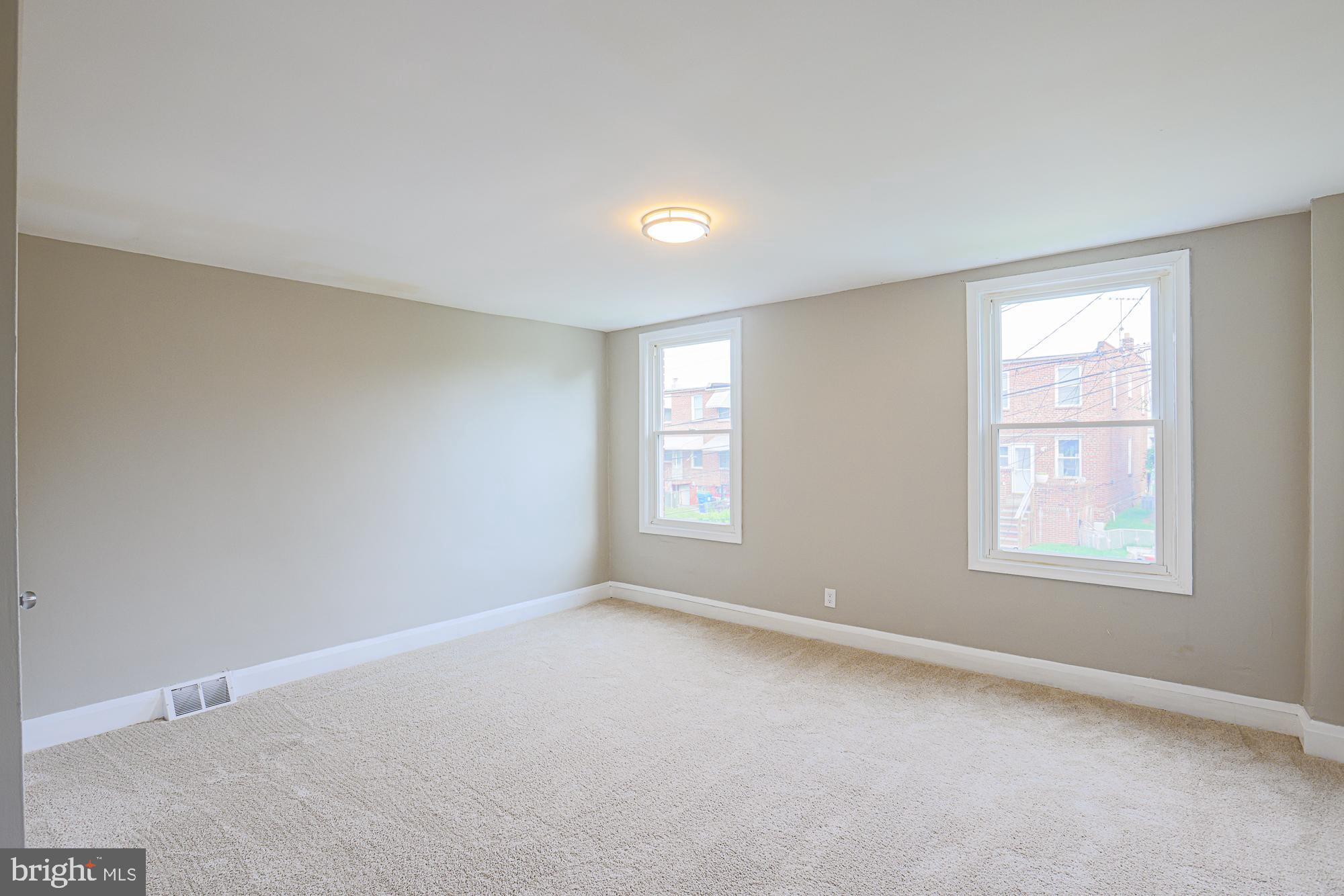 130 Reedbird Avenue Baltimore, MD 21225 - Photo 32 of 43 Second bedroom (back of house)