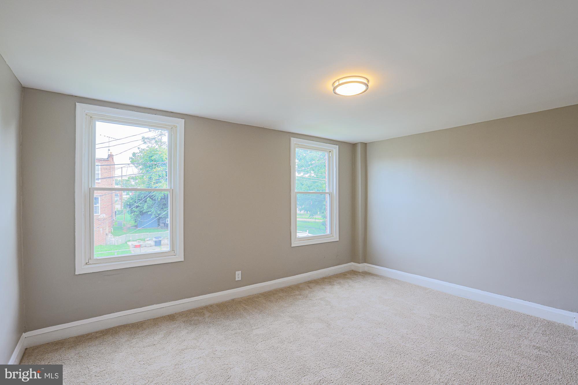 130 Reedbird Avenue Baltimore, MD 21225 - Photo 33 of 43 Second bedroom (back of house)