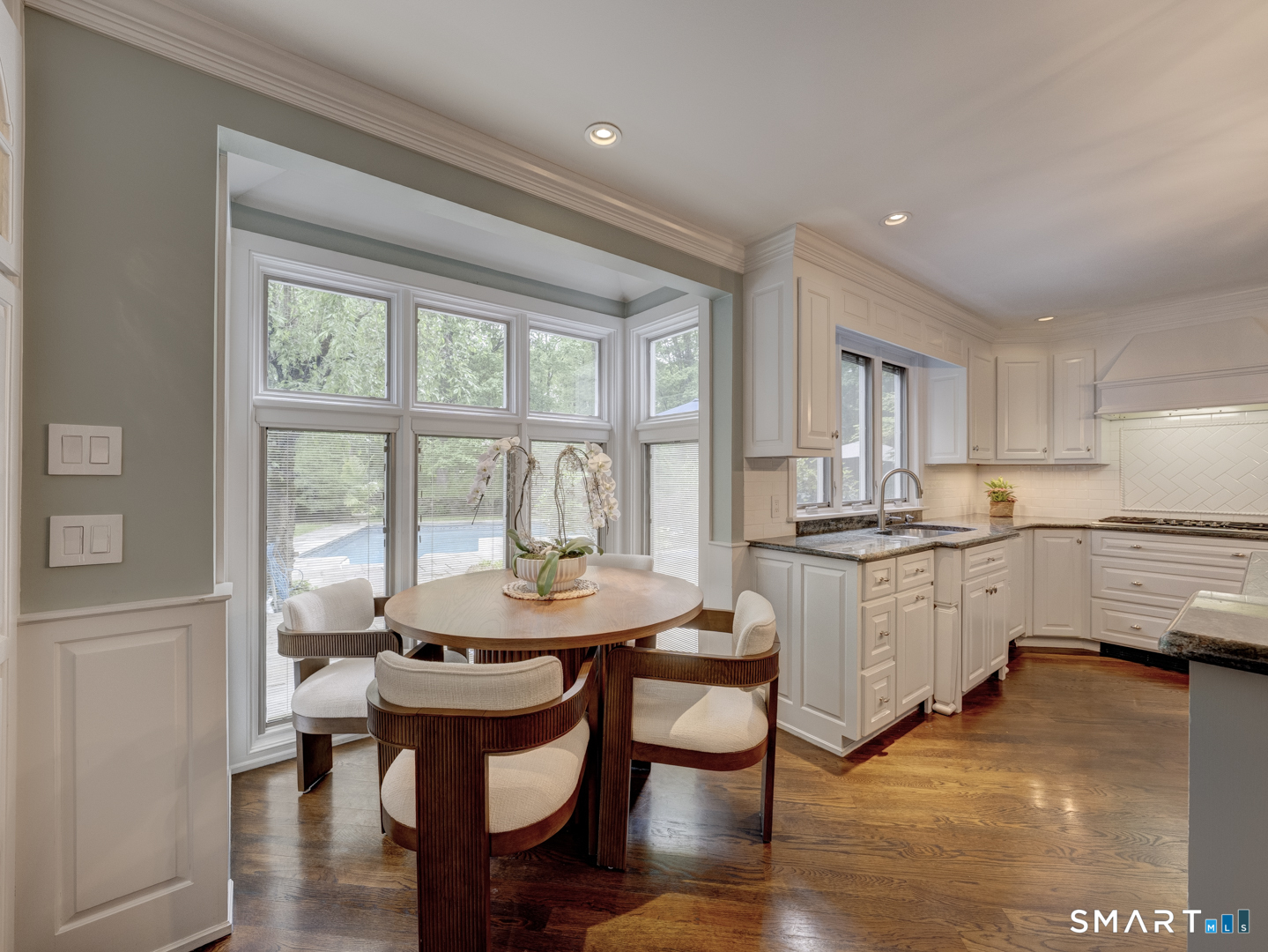 78 Windtree Street Torrington, CT 06790 - Photo 16 of 40 a kitchen with sink cabinets and wooden floor