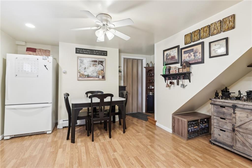 199 Latimer Avenue Strabane, PA 15363 - Photo 13 of 44 a view of a dining room with furniture a chandelier and wooden floor