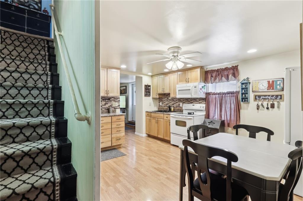 199 Latimer Avenue Strabane, PA 15363 - Photo 15 of 44 a open kitchen with white cabinets and stainless steel appliances
