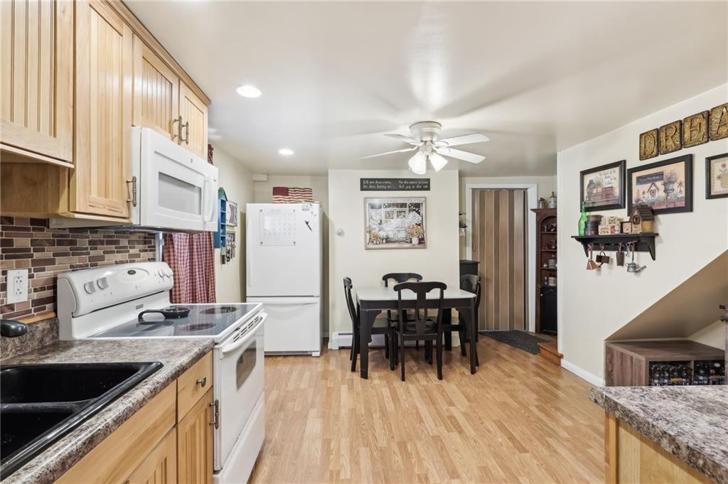 199 Latimer Avenue Strabane, PA 15363 - Photo 18 of 44 a kitchen with stainless steel appliances granite countertop a sink stove and refrigerator