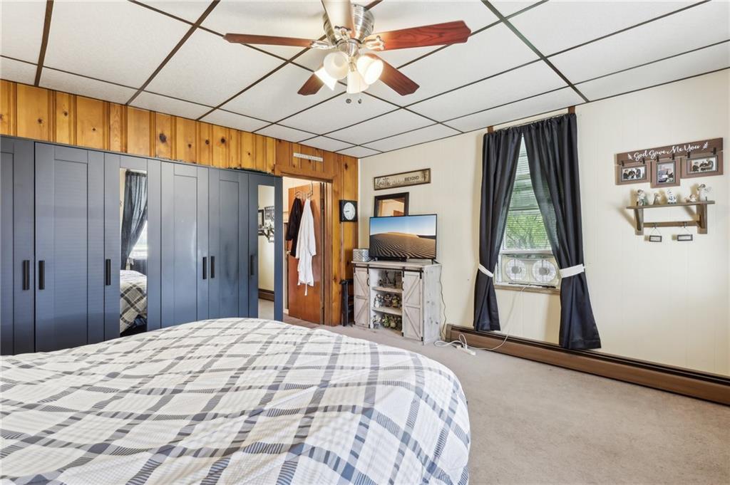 199 Latimer Avenue Strabane, PA 15363 - Photo 21 of 44 a bedroom with a bed and a flat tv screen