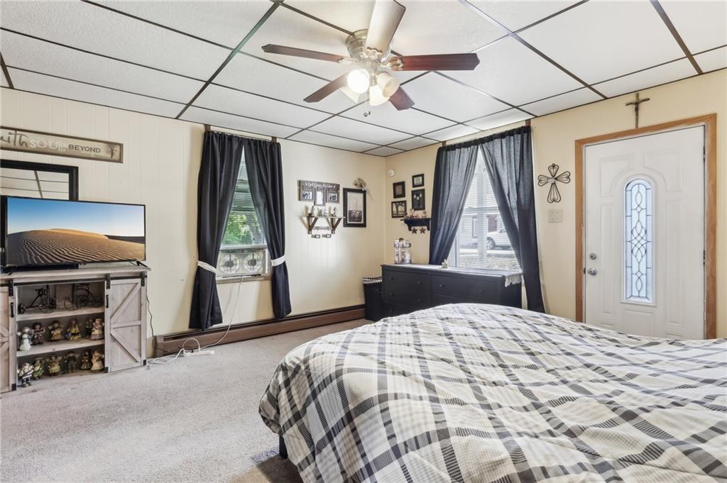 199 Latimer Avenue Strabane, PA 15363 - Photo 22 of 44 a bedroom with a bed and a flat tv screen