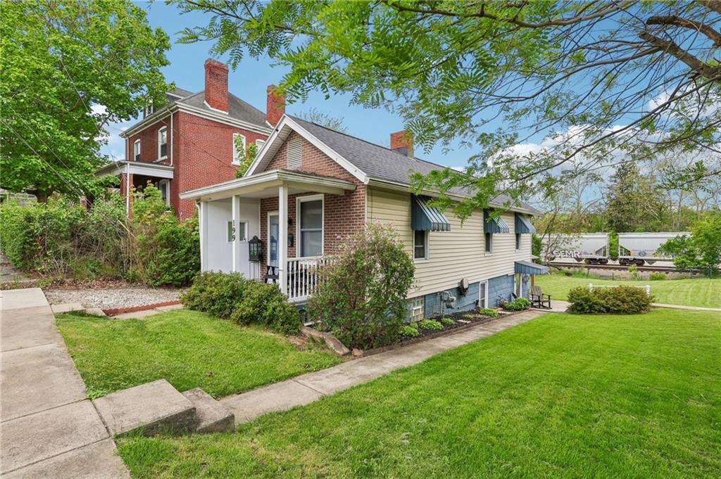 199 Latimer Avenue Strabane, PA 15363 - Photo 3 of 44 a front view of a house with garden