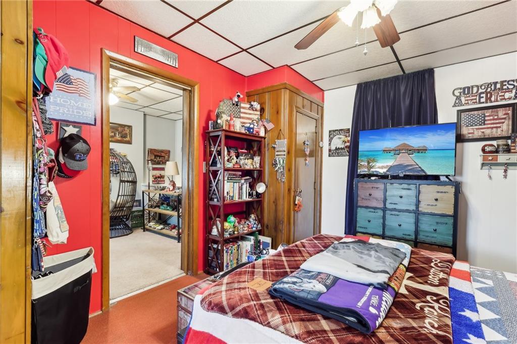 199 Latimer Avenue Strabane, PA 15363 - Photo 31 of 44 a bed room with a bed and a book shelf