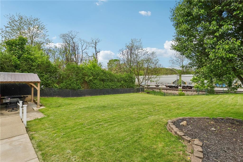 199 Latimer Avenue Strabane, PA 15363 - Photo 40 of 44 a view of a garden with lawn chairs