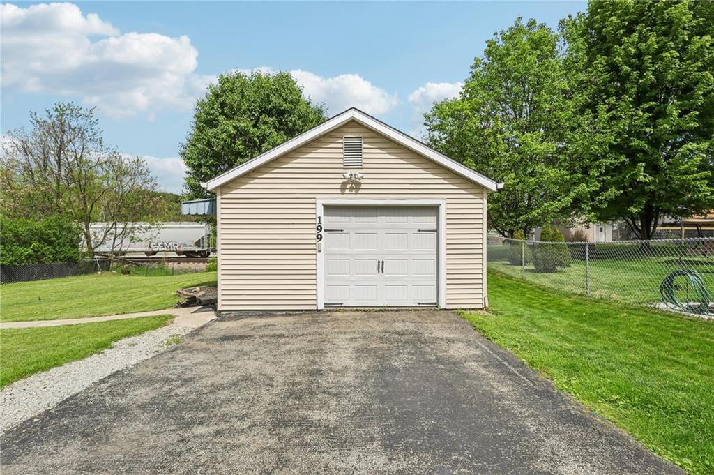 199 Latimer Avenue Strabane, PA 15363 - Photo 4 of 44 a view of a house with yard and a garden