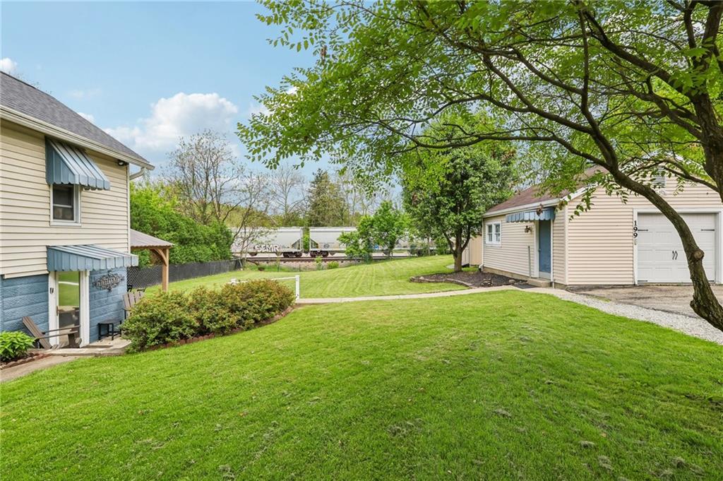 199 Latimer Avenue Strabane, PA 15363 - Photo 42 of 44 a view of a house with backyard and a tree