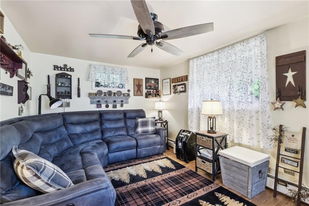 199 Latimer Avenue Strabane, PA 15363 - Photo 9 of 44 a living room with furniture and a flat screen tv