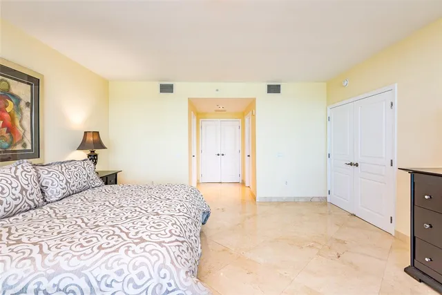 a bedroom with a bed and chair