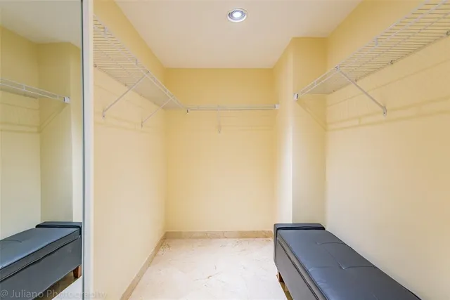 a bedroom with bed and window