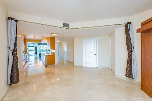 a view of a chairs and table in the balcony
