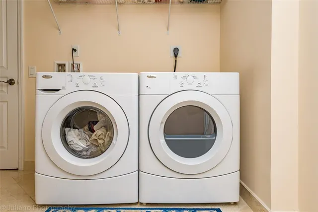 a view of a chairs and table in patio with wooden fence
