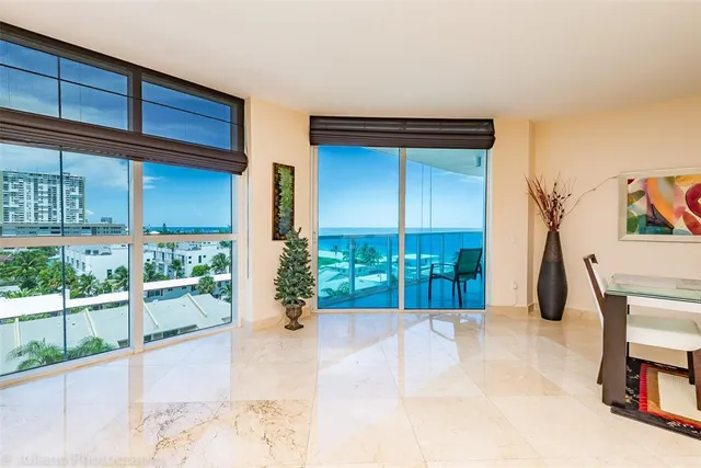 a bathroom with a granite countertop sink and a large mirror