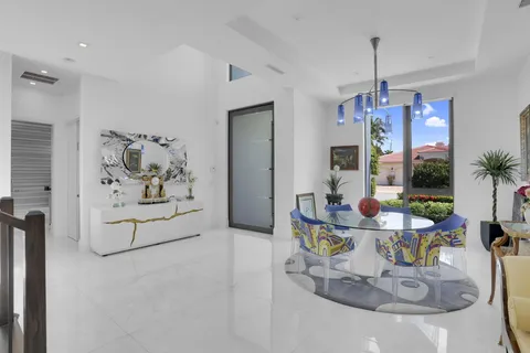 a kitchen with a stove and a large window