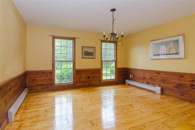 392 New Bedford Road Rochester, MA 02770 - Photo 6 of 11 a spacious bedroom with a bed and a window