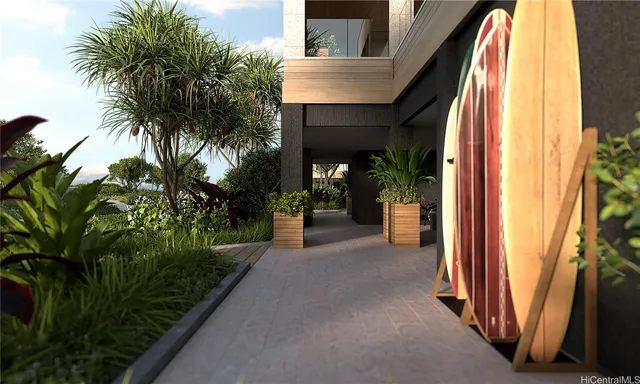 a view of a house with a patio and a yard