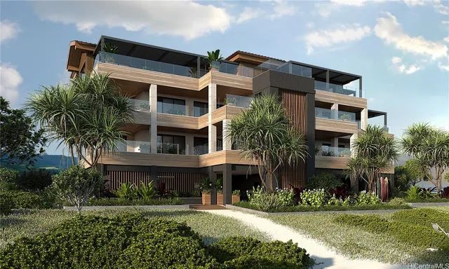 a front view of a building with a garden