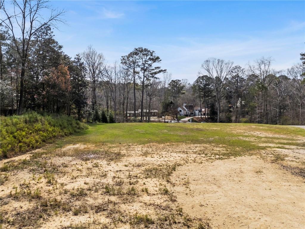 4931 Rebel Trail Atlanta, GA 30327 - Photo 12 of 30 a view of a field with trees in the background