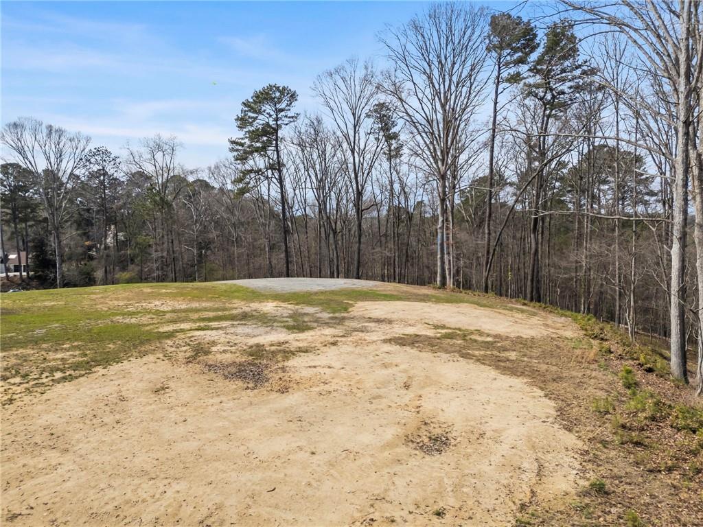 4931 Rebel Trail Atlanta, GA 30327 - Photo 13 of 30 a swimming pool with trees in front of it