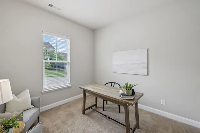 an empty room with wooden floor