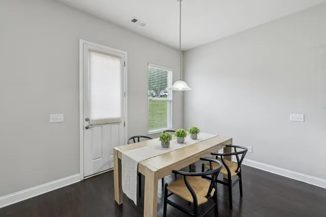 a large kitchen with stainless steel appliances granite countertop a lot of counter space a sink and a stove