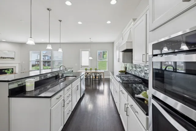 a kitchen with a sink and a refrigerator