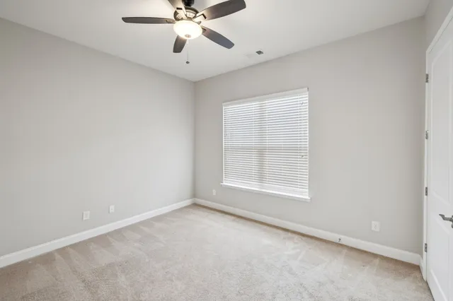 a bathroom with a shower curtain and a toilet