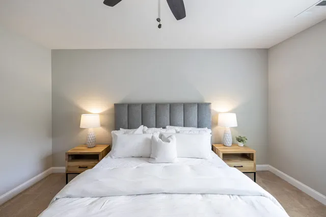 a white bath tub sitting next to a white sink