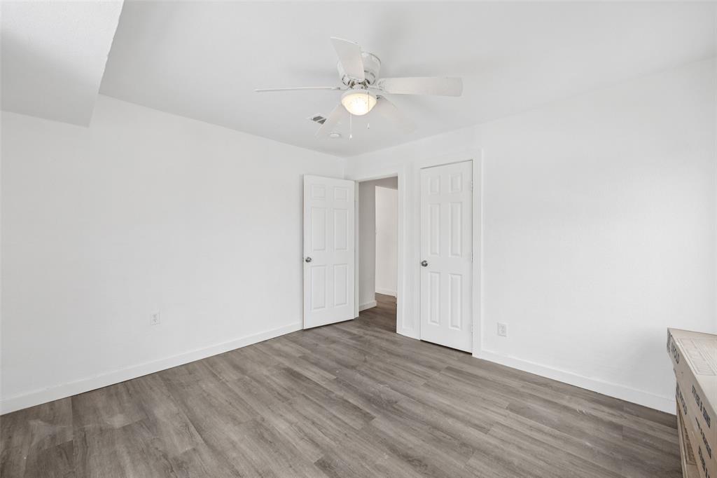 3847 Stalcup Road Fort Worth, TX 76119 - Photo 23 of 30 a view of an empty room with wooden floor