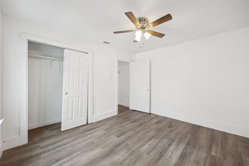 3847 Stalcup Road Fort Worth, TX 76119 - Photo 26 of 30 a view of an empty room with wooden floor