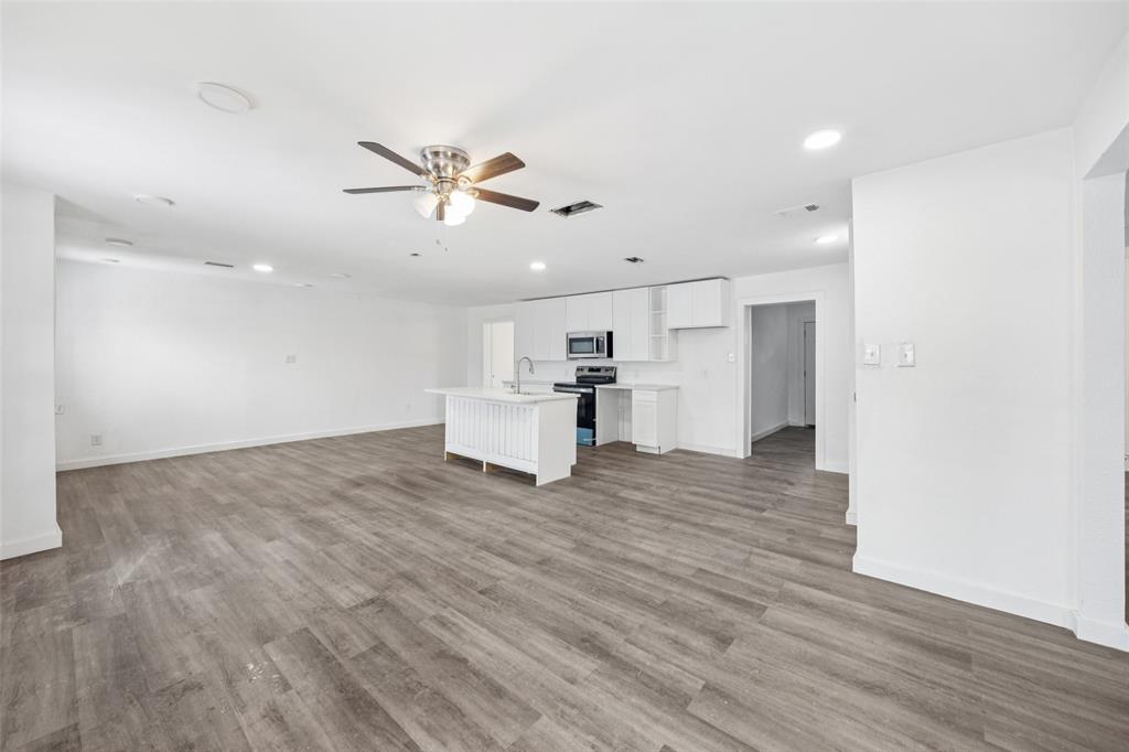 3847 Stalcup Road Fort Worth, TX 76119 - Photo 6 of 30 a view of kitchen with furniture and wooden floor