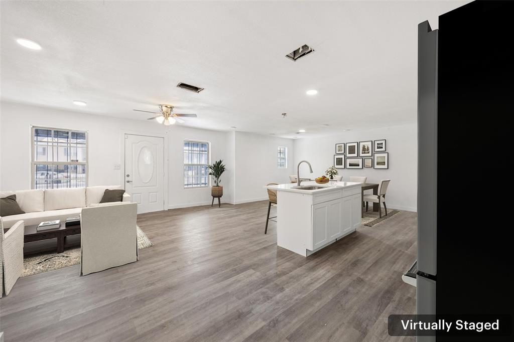 3847 Stalcup Road Fort Worth, TX 76119 - Photo 9 of 30 a living room with furniture and wooden floor