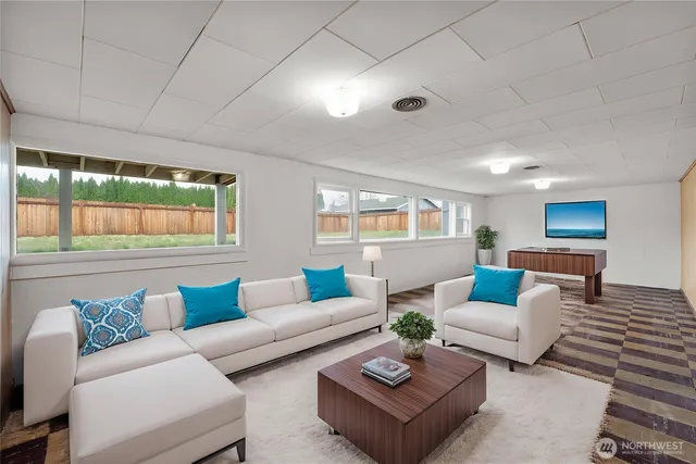 a living room with furniture and a large window