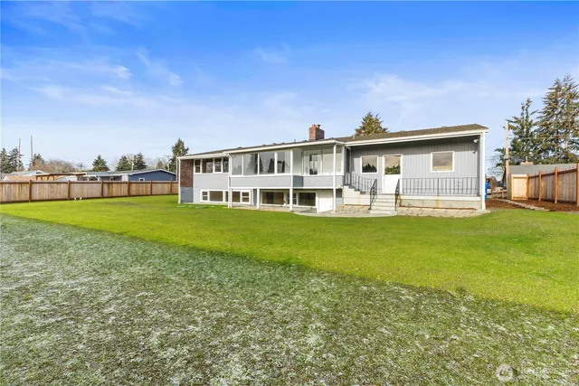 a view of a house with a big yard