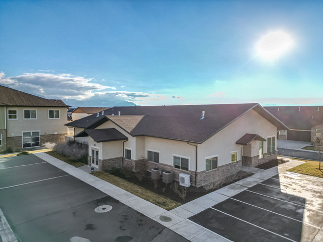 1810 West 300th Street South, Unit D Mapleton, UT 84664 - Photo 26 of 30 View of building exterior with uncovered parking