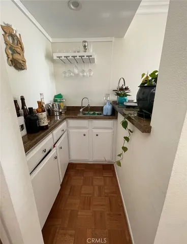 a kitchen with a sink and cabinets