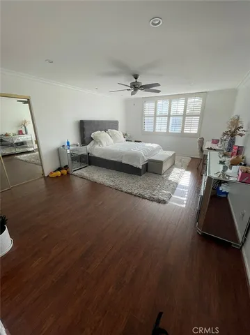 a bedroom with bed and window