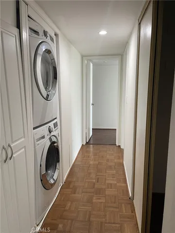a view of a hallway with washer and dryer