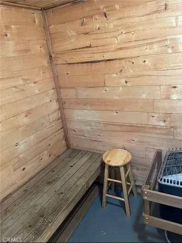 a wooden bench sitting in a chair