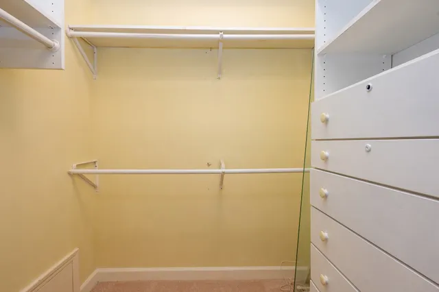 a view of a room with racks on the wall