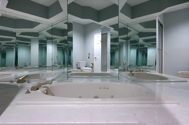 a bathroom with a bathtub and a sink