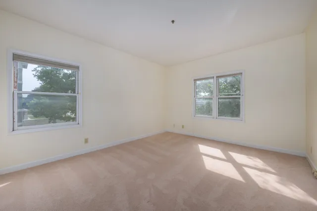 an empty room with windows